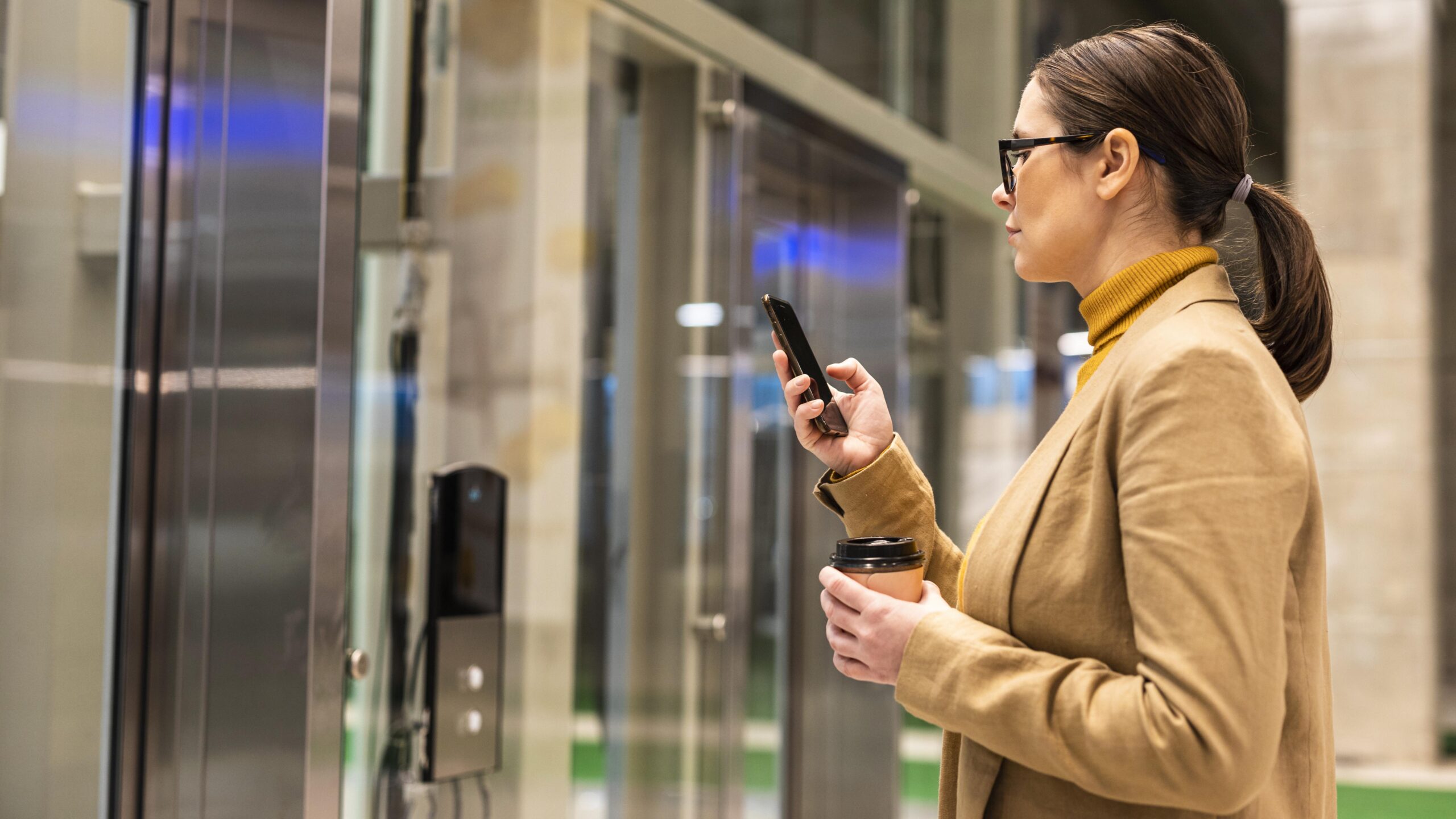 Access control solution - woman holding a phone